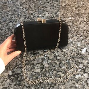 Hard shell clutch with silver cube closure